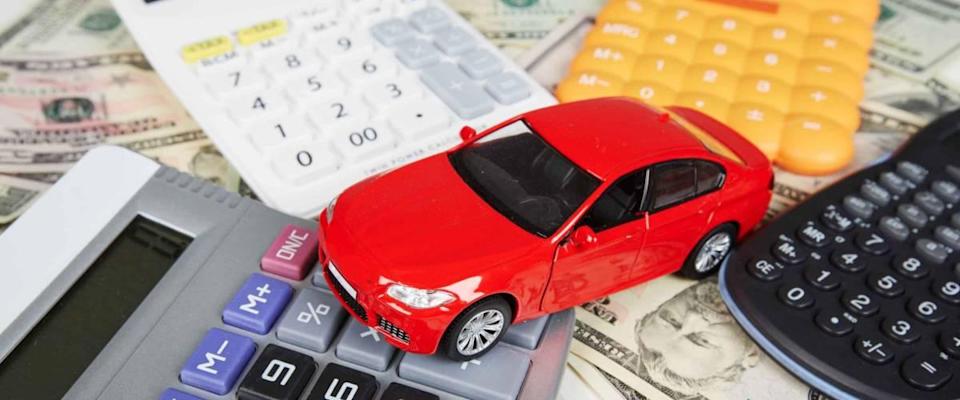 Car money and calculator. Payments and costs.