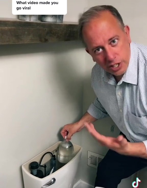 He uses a two-litre bottle to fill up space in the toilet flusher so it doesn't use as much water