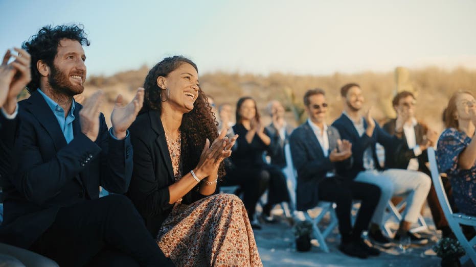 Wedding guest sit in aisle seats