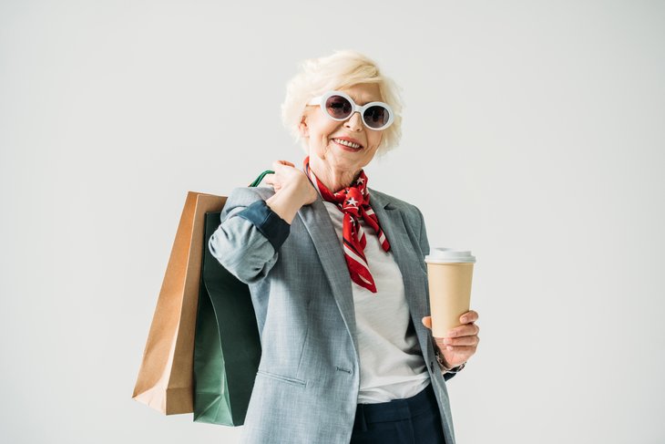 A happy older shopper takes advantage of senior discounts